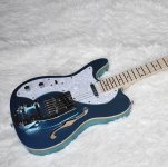 TELE blue lefty w: righty Bigsby.jpg