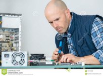 computer-repairman-using-soldering-iron-solder-computer-repairman-using-soldering-iron-120764888.jpg